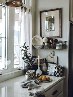 a kitchen counter topped with plates and bowls