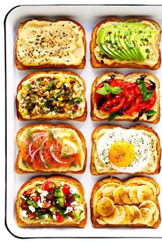 an assortment of toasted sandwiches with different toppings on them, arranged in a griddle