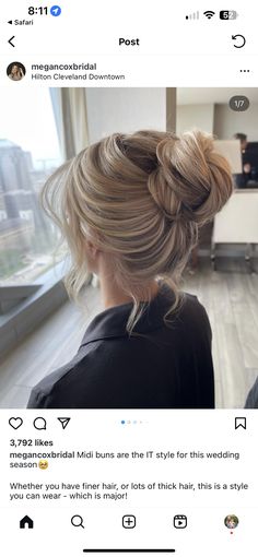 the back of a woman's head with blonde hair styled into a low bun