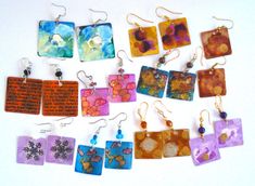 a collection of earrings with different designs on them