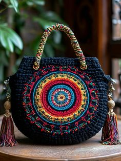 a crocheted bag sitting on top of a wooden table