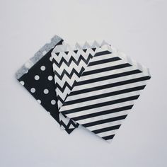 three pieces of black and white fabric with polka dots