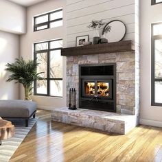 a living room with a fire place in the center and wood floors on both sides