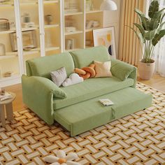 a living room with a green couch and coffee table