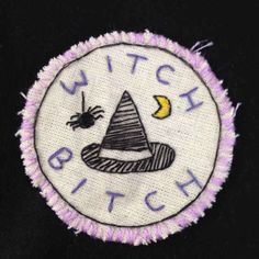 the witch patch has been embroidered onto it