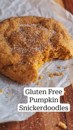 a close up of a cookie on a piece of wax paper with the words gluten free pumpkin snickerdoodles