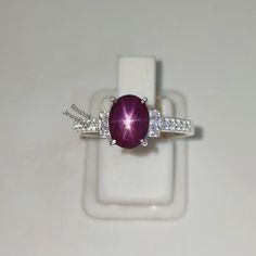 BAND - ROUNAK JEWELLERS MATERIAL - 925 STERLING SILVER GEMSTONE - 100% NATURAL STAR RUBY STAR RUBY STONE WEIGHT - 2.25 CARAT STAR RUBY STONE SIZE - 6.20 X 8.20 MM SECONDARY STONE - CUBIC ZIRCONIA ZIRCONIA STONE WEIGHT - 0.25 CARAT ZIRCONIA STONE SIZE - 1.10 MM   GROSS WEIGHT - 2.830 GM STONE SHAPE - OVAL, ROUND GEM COLOUR - RED, WHITE RING SIZE - ALL SIZE AVAILABLE PLEASE GIVE YOUR OPENION OR FEEDBACK ABOUT THE PRODUCT. WE ACCEPT BULK ORDER ALSO. https://www.etsy.com/in-en/shop/RounakJewellers?r Dainty Ruby Ring, Blue Star Sapphire Ring, Star Ruby Ring, Star Sapphire Ring, July Birthstone Ring, Blue Star Sapphire, Ruby Engagement Ring, Ring Stacking, Star Ruby