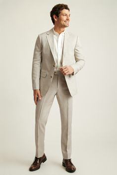 Lightly constructed in Italian linen. Wear separately or as a full suit with matching dress pants. Classic Fitted Linen Set, Modern Fitted Linen Suits, Classic Linen Workwear Sets, Elegant Beige Linen Sets, Formal Linen Long Sleeve Sets, Formal Linen Sets With Long Sleeve, Formal Long Sleeve Linen Sets, Timeless Beige Suits For Spring, Suit For Men Wedding