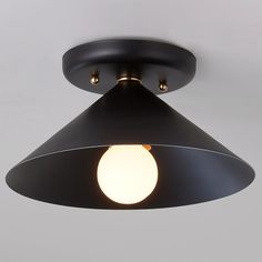 a black ceiling light with a white ball on it