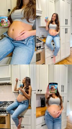 a pregnant woman in jeans poses for the camera while holding a can of canned drink