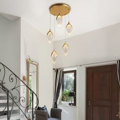 a living room filled with furniture and a spiral staircase