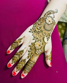 a woman's hand with henna on it