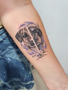 a dog's face is shown on the arm and behind it are purple flowers