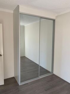 an empty room with sliding glass doors in it