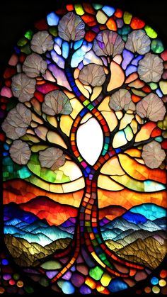 a stained glass window with a tree on it's side and mountains in the background