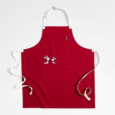 a red apron with an embroidered mickey mouse on the front and white straps around it