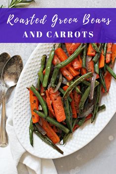 roasted green beans and carrots on a white plate with a spoon next to it