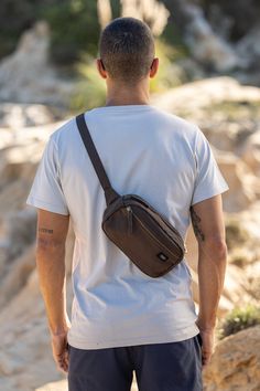 Not too big, not too small, wearable on your hip or as a tiny sling bag—this Cadera Fanny Pack is ready to roll when you are. Pack your essentials in this eco-friendly fanny pack made with organic cotton canvas when you want to move through the day with your hands-free. Bag: 6"(H) x 9"(W) x 2.5"(D) Made with 14-oz Certified Fairtrade Organic cotton canvas Long pull zipper Front pocket with zipper Inside pocket Detachable hook on one side for easy strap adjustments YKK lead-free antique finish me Everyday Brown Chest Bag With Zipper Pocket, Brown Chest Bag For Everyday Use, Brown Chest Bag For Everyday, Brown Chest Bag With Anti-theft Pocket For Everyday Use, Everyday Brown Chest Bag With Anti-theft Pocket, Brown Everyday Shoulder Bag With Anti-theft Pocket, Everyday Brown Chest Bag With Pockets, Brown Crossbody Bag With Functional Pockets, Functional Brown Chest Bag With Removable Pouch