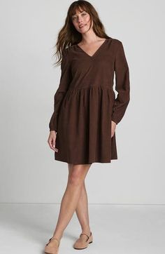 This dress is made from soft, lightweight corduroy, giving it a gentle texture that's super comfy. The effortless slip-on style and relaxed fit make it perfect for all-day wear, letting you move freely. The shirred waist adds a bit of shape without sacrificing comfort. It's a great addition to your wardrobe for its practical style. Soft pinwale corduroy Pull-over style V-neckline with finished trim Long sleeves finished with elastic at wrists On-seam pockets Gently shirred at the waist and shoul Brown Relaxed Fit Dress For Fall, Corduroy Dresses For Spring, Casual Knee-length Corduroy Dress, Long Sleeve Brown Corduroy Dress, Spring Casual Corduroy Dress, Casual Spring Corduroy Dress, Casual Corduroy Dresses For Work, Brown Corduroy Dress For Fall, Brown Long Sleeve Corduroy Dress