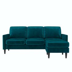 a blue couch and footstool sitting next to each other on a white background