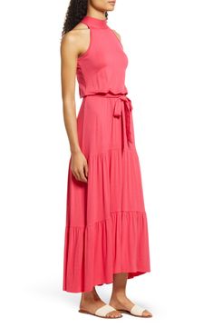 Your outfit-of-the-day has never looked better in this flowy tiered maxi dress fashioned with a high halter neckline and tie-belted waist. 52" length Halter neck Sleeveless, with cutaway shoulders 95% rayon, 5% spandex Machine wash, dry flat Imported Tiered Flowy Skirt Maxi Dress, Pink Polish, Halter Maxi Dress, Halter Maxi, Halter Maxi Dresses, Tiered Maxi Dress, Pink Maxi Dress, Style Maxi Dress, Halter Neckline