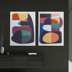 two abstract paintings hang on the wall next to a dresser and sideboard in a living room