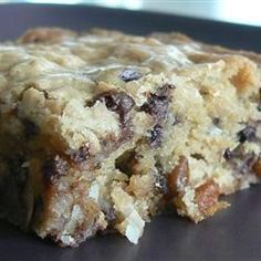 a chocolate chip cookie bar sitting on top of a black plate