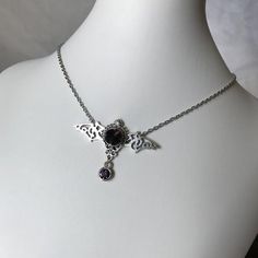 This gothic vampire inspired necklace is made with an antiqued silver plated filigree bat and findings, accented with sparkling glass crystals in DEEP VIOLET PURPLE. Wingspan is 2 1/4" wide and centerpiece is 1 1/2" tall in the center.necklace isadjustable 15-18" with a lobster clasp and chain extender in the back. If you would like a different length or stone color, please send us a message. Matching headpiece is available in our store. Goth Jewelry Violet Vixen, Gothic Pendant Necklace For Halloween, Halloween Gothic Pendant Jewelry, Halloween Gothic Pendant Necklace, Gothic Nickel-free Necklace For Halloween, Gothic Metal Jewelry For Fantasy Events, Gothic Nickel-free Necklaces For Halloween, Silver Gothic Jewelry For Fantasy Events, Silver Vampire Style Necklace