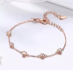 Elegant Vermeil Cubic Zirconia Heart Shaped 14k Rose Gold Bracelet, Engagement Gift, Bridal Wedding Gift, Anniversary Birthday Gift For Her. Treat yourself or your loved ones with a special gift. Dispatched with Royal Mail First Class. Bracelet length:233mm Total weight:2.50g Product Care These bracelets are rose gold vermeil on sterling silver 925 which we all know that with good care they could last for years if properly maintained. Although resistant, the metals and crystals that have been used are sensitive to their environment. To preserve them over time, please follow these recommendations: -wash it with a small amount of gentle dish soap or non-chemical soap and warm water. -rinse it well and allow to dry on a cloth or paper towel. -use a soft, non-abrasive cloth or jewellery cloth Cheap Rose Gold Heart-shaped Bracelet, Heart Shaped Crystals, Shaped Crystals, 14k Rose Gold Bracelet, Gold Armband, Rose Gold Chain, Vermeil Jewelry, Gold Bracelet Chain, Birthday Gift For Her