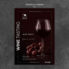 a wine tasting flyer with grapes and a glass of wine on the table in front of it