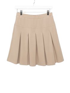 Our Basic Skort is almost too cool for school. This staple combines a classic pleated skirt style with a modern skort structure to create the most functional + chic uniform basic ever. Pair it with our Basic Legging during chilly months to stay stylish all year long! Color: Camel Rollable elastic waistband Pleated style on front + back Soft, sewn-in shorts under skirt Hidden side pockets on shorts Printed inner tag Material + Wash Main body: 62% nylon | 33% polyester | 5% spandex Lining: 100% polyester Machine wash gentle with like colors Dry on low heat Sizing + Fit True to size Please check the size guide before ordering Khaki Skirt Uniform, Beige Pleated Skirted Skort, Beige Pleated Mini Length Skort, Beige Mini Pleated Skort, Cheap Beige Knee-length Mini Skirt, Pleated Skirt Style, Shorts Under Skirt, Knee-length Beige Lined Mini Skirt, Skirt Uniform