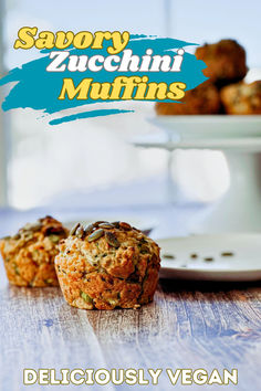 side view of two muffins on a table. Several muffins are in the back on a cake stand. Savory Zucchini Muffins, Vegan Zucchini Muffins, Vegan Shredded Cheese, Fresh Zucchini, Vegan Muffins, More Veggies, Work Lunches