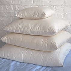 four pillows stacked on top of each other