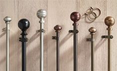 an assortment of metal and wood door handles