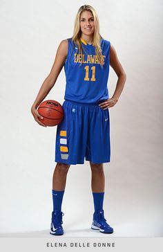 a female basketball player is posing for a photo