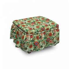 the ottoman is covered with a floral print