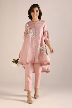 Blush asymmetric kurta featuring printed camellia flower motifs highlighted by crochet lace detail. Comes with matching pant. - Aza Fashions Designer Wear Spring Kurta With Set-in Sleeves, Designer Spring Kurta With Set-in Sleeves, Elegant Cotton Palazzo Set For Spring, Elegant Spring Cotton Palazzo Set, Chic Sets With Resham Embroidery For Spring, Spring Asymmetrical Sets, Spring Designer Wear Straight Kurta Set, Designer Long Sleeve Pant Set For Spring, Chic Designer Wear Sets For Spring