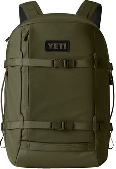 a green backpack with the word yeti on it's front and back straps