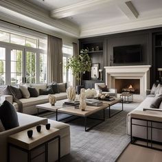 a living room filled with furniture and a fire place in the middle of a room