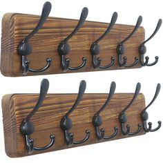 three hooks are attached to a wooden coat rack