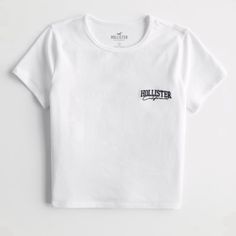 New From Hollister 100% Cotton Basic Logo Print Top For Spring, Basic Spring Top With Logo Print, Orange Tees, Baby Graphic Tees, Hollister Shorts, Striped Polo Shirt, Blue Tee, Hollister Tops, Baby Tee