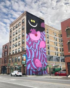 a tall building with a colorful mural on it's side