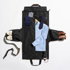 A travel-wardrobe game-changer, this suit garment bag zips up at the side to transform into a carry-on duffle bag. One of our most popular travel gifts, this innovative design will keep dress clothes, shoes and other essentials neatly organized while you're on the move. Slide your hanging items into the garment bag, insert shoes and accessories into the pockets and then zip up the sides to convert into a duffle bag. The smart design also includes carry handles and an adjustable shoulder strap an Rangement Caravaning, Travel Bag Essentials, Mens Travel, Mens Travel Bag, Mark And Graham, Embroidered Monogram, Travel Wardrobe, Garment Bag, Dress Clothes