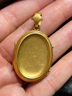 ". This beautiful oval locket has that gorgeous Victorian \"bloom\" to the gold that cannot be duplicated. It really can't be duplicated because the process has been illegal for almost 100 years now. The bale is an abstract fleur de lis shape. This locket is plated in 18k, thick enough to test 18k on the electronic tester! This locket does not have removable photo rings, but a printed picture could be carefully pressed in so it sits under the edge. I just print from my home printer on photo pape Antique Oval Jewelry With Polished Finish, Yellow Gold Oval Pendant Locket Necklace For Memorial, Heirloom Yellow Gold Oval Pendant Locket Necklace, Classic Oval Locket Necklace Stamped 14k, Yellow Gold Oval Locket Necklace For Memorial, Elegant Gold Oval Locket Necklace, Oval Engraved Yellow Gold Locket Necklace, Oval 14k Yellow Gold Locket Necklace, Collectible Yellow Gold Jewelry With Oval Cabochon