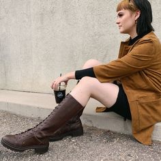 This brown knee-high boot has all the class of a riding boot but all the street cred of a combat boot! You can't go wrong with a pair of these boots that are a proven fan favorite. Rocket Dog women's boot Brown faux leather upper Brown shoe laces Studded details Slight chunky heel Rounded toe Thick rubber sole Heel height 2 inches Platform height 1 inch Shaft height 13 inches Dark Brown Shoes, Brown Boots Women, Brown Knee High Boots, Tall Boot, Rocket Dog, Combat Boot, Riding Boot, Brown Shoe, The Class