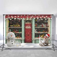 a christmas scene with snowman, sleigh and storefront