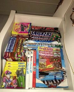 a drawer filled with lots of candy and snacks