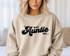 In My Auntie Era Sweatshirt, Auntie Sweatshirt, Gift for Aunt, In My Era Sweatshirt, Aunt Gift, Aunti Sweatshirt, Auntie Gift, Aunt Sweater Thank you for visiting our shop. This special auntie sweatshirt is part of our unique family collection. Please order for your loved one. ABOUT SWEATSHIRTS AND INK: This Sweatshirt is perfect for any occasion! Easy to style sweatshirt - can wear it fitted or size up for an oversized look and fit. A sturdy and warm sweatshirt bound to keep you warm in the col In My Auntie Era Sweatshirt, Auntie Era Sweatshirt, In My Auntie Era, Aunt Sweatshirts, Aunt Sweater, Auntie Sweatshirt, Family Sweatshirts, Marching Band Mom