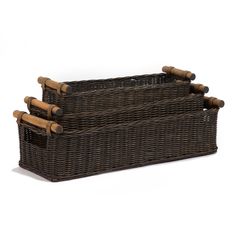 three brown wicker baskets with wooden handles