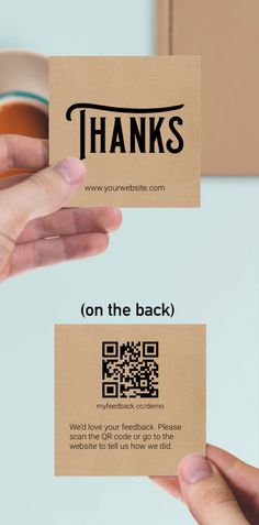 two hands holding business cards that say thanks on the back and thank you're here